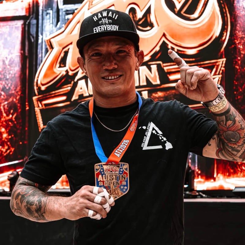 Coach Paul Conn in an Island Jiu-Jitsu shirt with a medal at the ADCC Austin Open