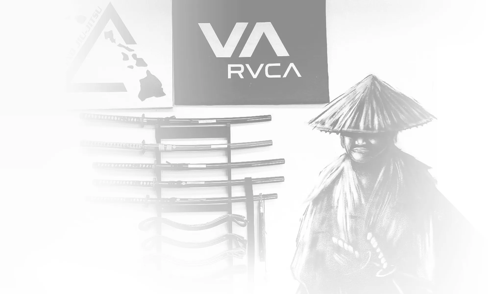 The samurai mural, sword rack and Island Jiu-Jitsu triangle painted on the dojo wall