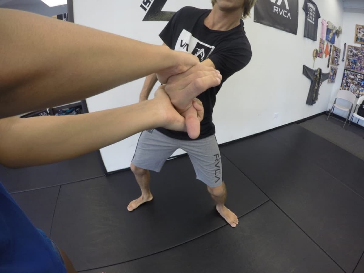 First-person view of a wrist-grab escape drill with an instructor during women's self-defense